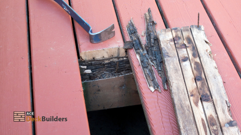 gray crow bar on damaged wooden deck